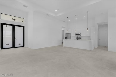 Unfurnished living room with concrete flooring, vi
