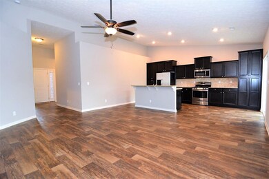 Open concept living with laminate tile floors made