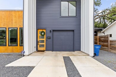 Garage featuring concrete driveway
