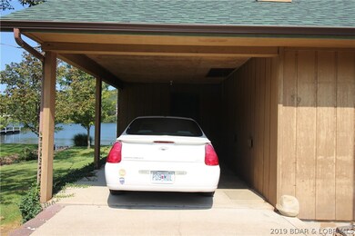 Carport with pull down storage and entry to home