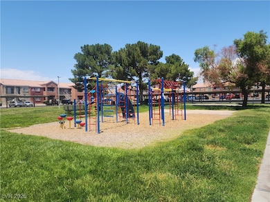 Community jungle gym featuring a lawn