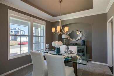Formal Dining with a vaulted ceiling and hutch alc