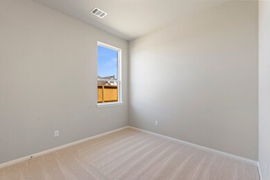 Your secondary bedroom features plush carpet, fres