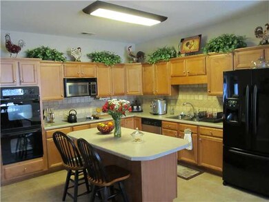 The 17x15 kitchen has GE double oven, microwave, d