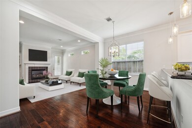 An open concept layout with hardwood floors throug