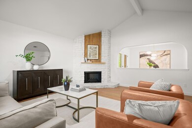 Living area featuring a fireplace, wood finished 