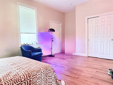 A private retreat with outdoor access and a built-in nook for added storage or a stylish workspace.