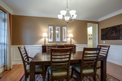 Formal dining room is large enough to seat 12 comfortably.  Details include beautiful wainscoating and sand and finish hardwood floors.