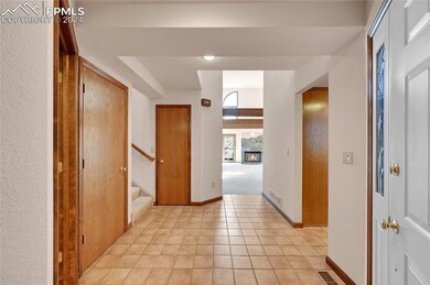 Hallway with light tile flooring