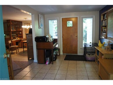 Spacious entry/mud room with ceramic tile.