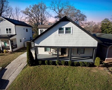 Rear view of house featuring a patio area and a la