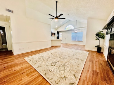 Living room with high vaulted ceiling