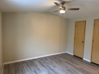 Spare room featuring ceiling fan and LVP floors