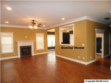 Waterford Plan B - Brick home with 3 car garage and bonus / bed / bath upstairs.