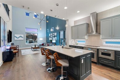 Kitchen featuring visible vents, light wood-style 