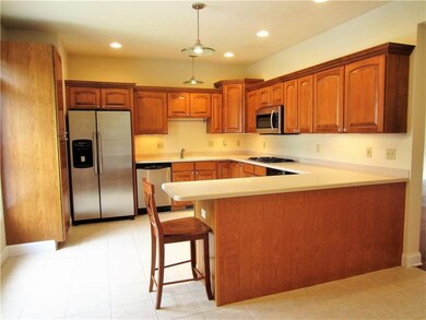 Huge 17 x 13 Kitchen with Maple Cabinets and Stain