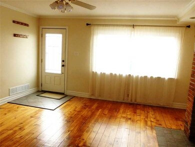 Living Room. Refinished pine floors, ceramic tile 