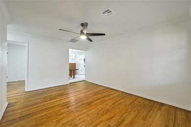 Empty room with visible vents, baseboards, a ceili