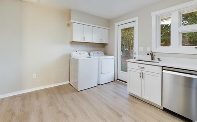 Laundry area featuring washer and dryerin kitchen area