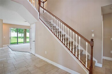 Tiled Entry on main floor with carpeted stair case