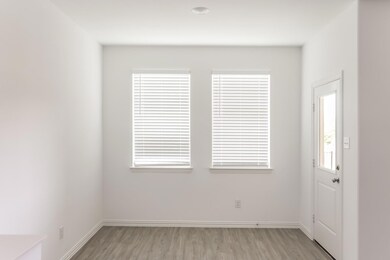 Unfurnished room with light hardwood / wood-style floors
