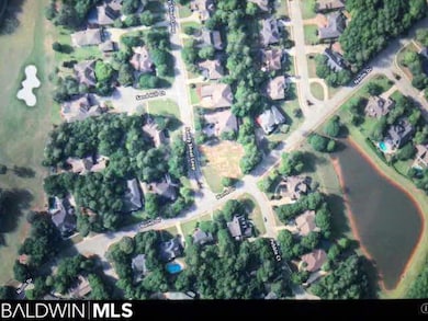 This aerial picture shows Lot 429 at the corner of North Drive & Sandy Shoal Loop & the view of the lake on the opposite side of North Drive, as well as how close this lot is the 14th & 15th fairways.