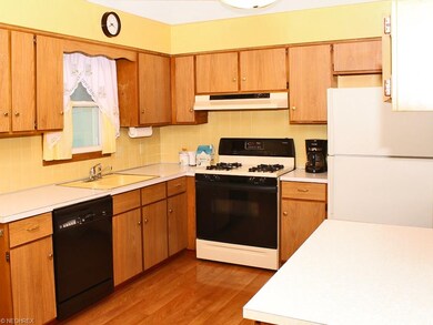 The floor is Pergo and the cabinets are oak with p