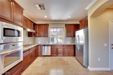 Kitchen featuring visible vents, light stone count