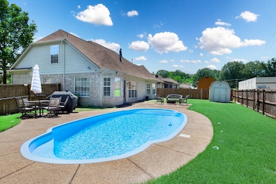 View of swimming pool featuring a patio area, outdoor dining area, and grilling area