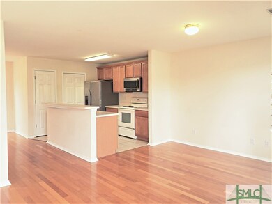 Walk in to the open concept living room and kitche