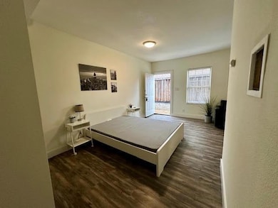 Kitchen featuring dark wood-style flooring, freest