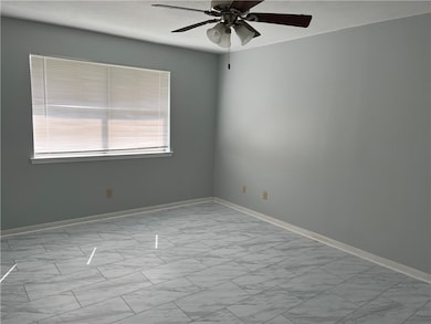 Unfurnished room featuring light gray laminate flo