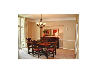 Large formal dining room with floor to ceiling win