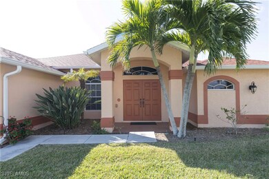 Entrance to property featuring a lawn