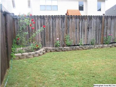 Beautiful brick rose garden in back yard