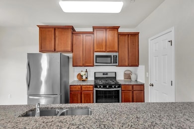 Kitchen featuring stainless steel appliances, dec