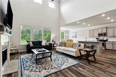 Expansive view of living area and kitchen and brea