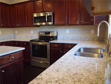 Beautiful new granite with a tile backsplash