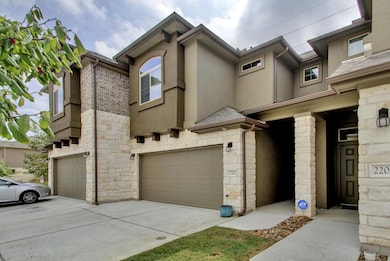 Multi unit property with stone siding, a garage, 