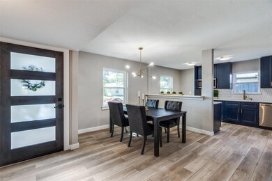 Dining room featuring a chandelier, light hardwood