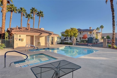Community pool featuring a patio area, a residenti