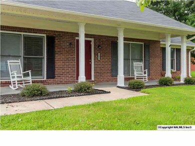 Under the inviting covered front porch, you'll find brand new sconce light fixtures and an attractive address plaque.