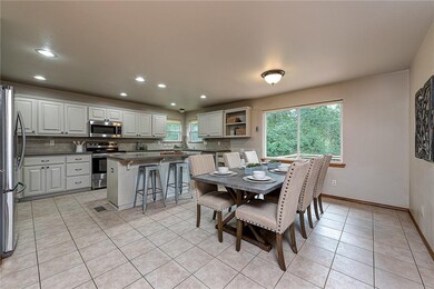 Eat-in kitchen | Stainless appliances convey