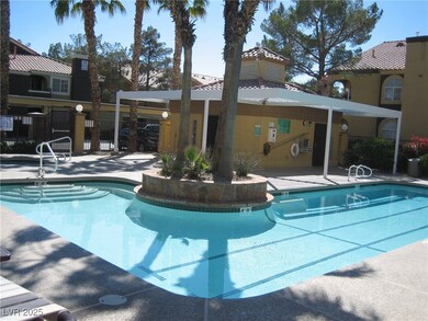 Community pool with fence and a patio