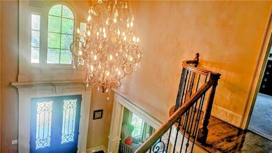 Two story entry foyer view from upper landing