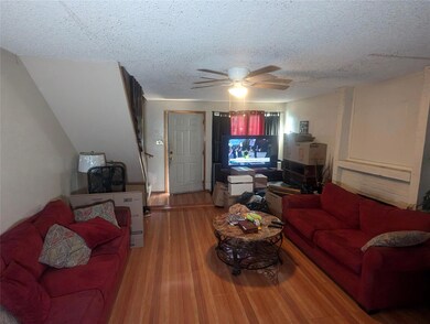 Living room with ceiling fan, hardwood / wood-styl