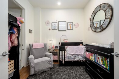 Bedroom featuring wood finished floors and recessed lighting