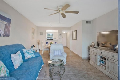 Tiled living room with ceiling fan