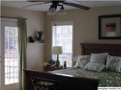 Master bedroom with French doors that open to pati