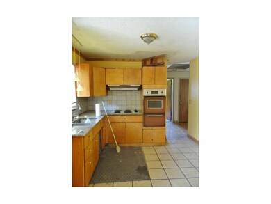 Kitchen With Tile Flooring, Plenty of Cabinetry, G